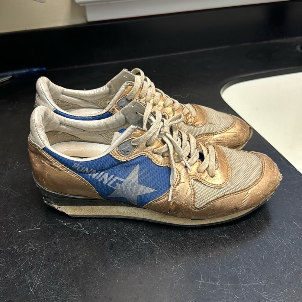 Well loved retro gold Golden Goose